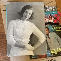 A photograph of a woman in a vintage knitting magazine